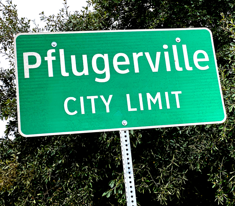 road sign for Pflugerville, TX